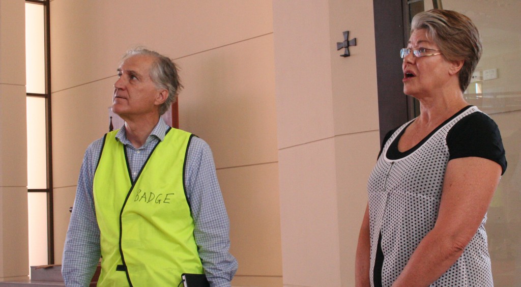 Lorraine Bond sings while Cathedral architect Marcus Collins listens.